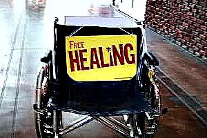 Free Healing, with photo of an empty wheelchair